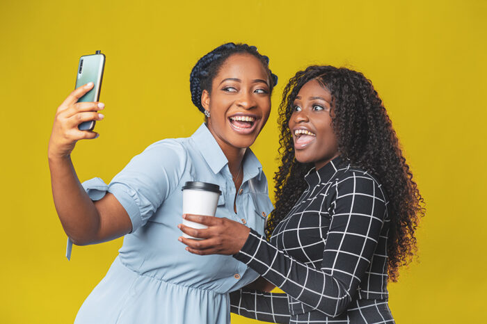 Two smiling women taking a selfie